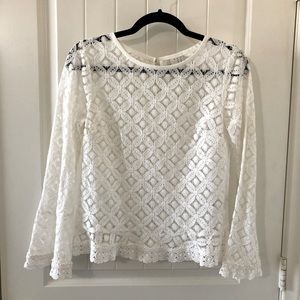 Lace blouse with bell sleeves.
